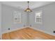 Bright bedroom with hardwood floors, neutral walls, and two windows at 1097 Dell Se Ave, Smyrna, GA 30080