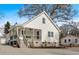 Modern farmhouse exterior, featuring a wraparound porch and gray concrete driveway at 1097 Dell Se Ave, Smyrna, GA 30080