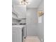 Convenient laundry room with washer, dryer, and shelving at 1097 Dell Se Ave, Smyrna, GA 30080