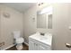 Basement bathroom with vanity, toilet and mirror at 1450 Tudor Pl, Grayson, GA 30017