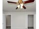 Bright bedroom with ceiling fan and two closets at 1450 Tudor Pl, Grayson, GA 30017