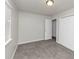 Bright bedroom with neutral walls, carpet, and double door closet at 1450 Tudor Pl, Grayson, GA 30017