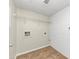 Laundry room with tile floor and shelving at 1450 Tudor Pl, Grayson, GA 30017