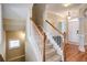 Elegant staircase leading to the upper level of the home at 1653 Perserverence Hill Nw Cir # 10, Kennesaw, GA 30152