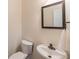 Small powder room with pedestal sink and toilet at 1630 Victoria Chase, Cumming, GA 30041