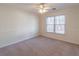 Spacious bedroom with ceiling fan and carpet at 1630 Victoria Chase, Cumming, GA 30041