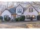 Two-story house with gray siding, brown shutters, and landscaping at 1630 Victoria Chase, Cumming, GA 30041