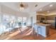 Kitchen with island, hardwood floors, and granite countertops at 1630 Victoria Chase, Cumming, GA 30041