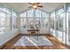 Sunroom with hardwood floors and large windows at 1630 Victoria Chase, Cumming, GA 30041