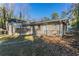 View of home's backyard, showing patio and partial fence at 1883 La Mesa Ln, Decatur, GA 30032