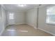 Finished basement area with tiled floors and a door to the outside at 1883 La Mesa Ln, Decatur, GA 30032