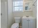 Small bathroom with shower, toilet and vanity at 1883 La Mesa Ln, Decatur, GA 30032