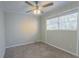 Bright bedroom with ceiling fan and neutral carpeting at 1883 La Mesa Ln, Decatur, GA 30032