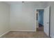 Simple bedroom with door to hallway and carpet flooring at 1883 La Mesa Ln, Decatur, GA 30032