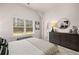 Main bedroom with large window and dresser at 566 Abbott Se Ct, Atlanta, GA 30354