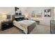 Bright bedroom with a plush bed, nightstands, and large window at 566 Abbott Se Ct, Atlanta, GA 30354