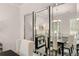 Bright dining room features large mirrors and a dark wood table with seating for six at 566 Abbott Se Ct, Atlanta, GA 30354