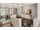 Elegant dining room with a dark wood table and mirrored wall at 566 Abbott Se Ct, Atlanta, GA 30354