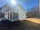 Side view of a two-story home with white siding at 566 Abbott Se Ct, Atlanta, GA 30354