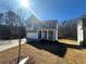 Two-story brick home with a white front door and attached garage at 566 Abbott Se Ct, Atlanta, GA 30354