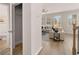 Hallway view of living room with light colored furniture and wood flooring at 566 Abbott Se Ct, Atlanta, GA 30354