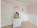 Well-lit room featuring built-in shelving and a dollhouse at 6980 Roswell Rd # E1, Sandy Springs, GA 30328