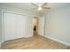 Bedroom with hardwood floors, ceiling fan and access to bathroom at 3377 Phillip Cir, Decatur, GA 30032