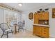 Bright eat-in kitchen with wood cabinets and tiled floor at 4812 Riveredge Dr, Peachtree Corners, GA 30096