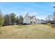 Large backyard and exterior view of house showing rear patio and yard at 125 Cinnamon Fern Cir, Covington, GA 30016