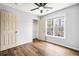 Bedroom with wood floors, window and closet at 125 Cinnamon Fern Cir, Covington, GA 30016