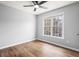 Bedroom with wood floors, window and ceiling fan at 125 Cinnamon Fern Cir, Covington, GA 30016