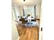 Dining room with hardwood floors and a modern dining set at 125 Cinnamon Fern Cir, Covington, GA 30016