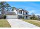 Exterior of home with large front yard and drive way at 125 Cinnamon Fern Cir, Covington, GA 30016