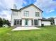 Two-story house with light siding, and a light blue door at 125 Cinnamon Fern Cir, Covington, GA 30016