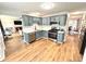 Kitchen with blue cabinets, quartz countertops, and stainless steel appliances at 125 Cinnamon Fern Cir, Covington, GA 30016