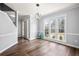 Sunlit living room showcasing wood floors, neutral paint, and decorative lighting at 125 Cinnamon Fern Cir, Covington, GA 30016