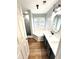 Main bathroom with a soaking tub, double vanity, and gray cabinets at 125 Cinnamon Fern Cir, Covington, GA 30016