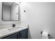 Stylish powder room featuring modern sink, vanity, and fixtures at 125 Cinnamon Fern Cir, Covington, GA 30016