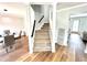 Carpeted staircase in a light-filled entryway at 125 Cinnamon Fern Cir, Covington, GA 30016