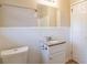 Bathroom with granite countertop and white tile at 3018 Meadowview Se Dr, Atlanta, GA 30316