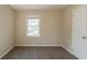 Spacious bedroom with neutral carpeting and a large window at 3018 Meadowview Se Dr, Atlanta, GA 30316