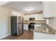 Updated kitchen with stainless steel appliances and granite countertops at 3018 Meadowview Se Dr, Atlanta, GA 30316