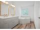 Elegant bathroom with double vanity, soaking tub, and updated fixtures at 435 Berkshire Dr, Covington, GA 30016