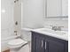 Clean bathroom with a vanity, toilet, and bathtub at 435 Berkshire Dr, Covington, GA 30016