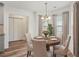 Charming dining area featuring a wood table and four chairs at 435 Berkshire Dr, Covington, GA 30016