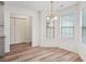 Bright dining room with bay window and wood floors at 435 Berkshire Dr, Covington, GA 30016