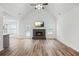 Living room with fireplace, vaulted ceiling and wood flooring at 435 Berkshire Dr, Covington, GA 30016