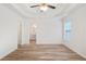 Main bedroom with wood flooring and access to bathroom at 435 Berkshire Dr, Covington, GA 30016