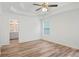 Bright and airy main bedroom with wood-look floors at 435 Berkshire Dr, Covington, GA 30016