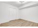 Spacious bedroom with double doors and light wood-look floors at 350 Jayne Ellen Way, Alpharetta, GA 30009